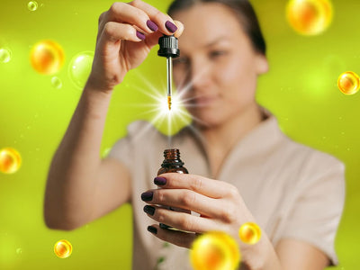 A woman lifting a pipette out of a vial while showing what CBD is