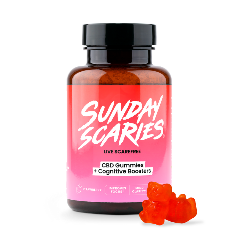 A bottle of Sunday Scaries CBD Gummies for Focus with a couple of pink gummy candies in the foreground.