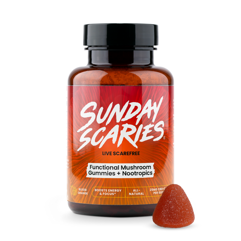 A bottle of Sunday Scaries Functional Mushroom Gummies with one gummy visible in front of the bottle.