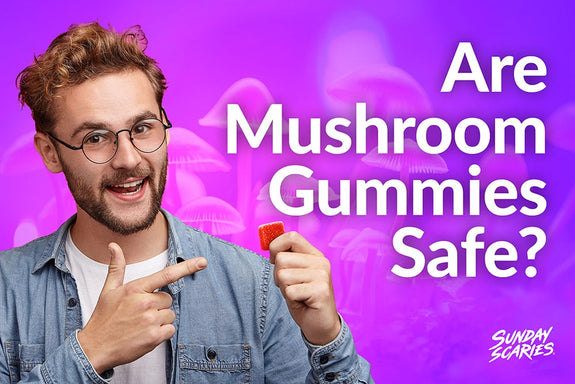 A man is holding up a sunday scaries gummy showing how mushroom gummies are safe