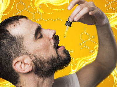 A man drops CBD oil in his mouth while wondering if he can take too much of it