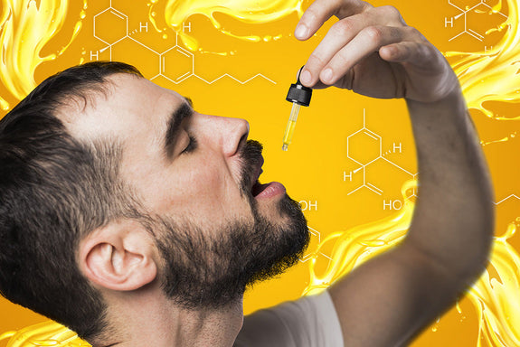 A man drops CBD oil in his mouth while wondering if he can take too much of it