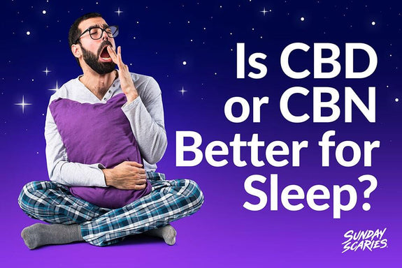 An image of a man holding a pillow and yawning while questioning whether CBD or CBN is better for sleep