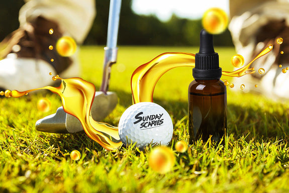 A golfer about to putt a ball with CBD for golf next to the golf ball