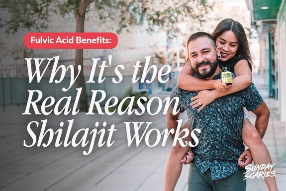 A woman holding a Sunday Scaries Shilajit gummies bottle jumps on the back of her boyfriend. 