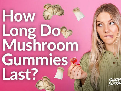 A skeptical woman holds up a mushroom gummy wondering how long they last