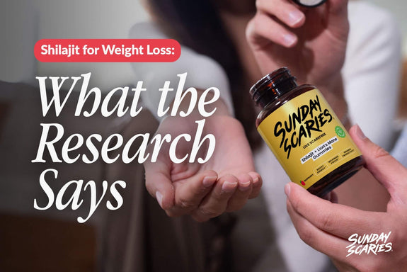 A man shares his bottle of Sunday Scaries Shilajit gummies with a woman as she holds her hand out. 