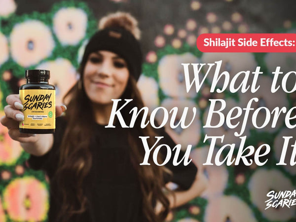 A woman with a beanie on in front of a graffiti wall holds up Sunday Scaries Shilajit gummies. 