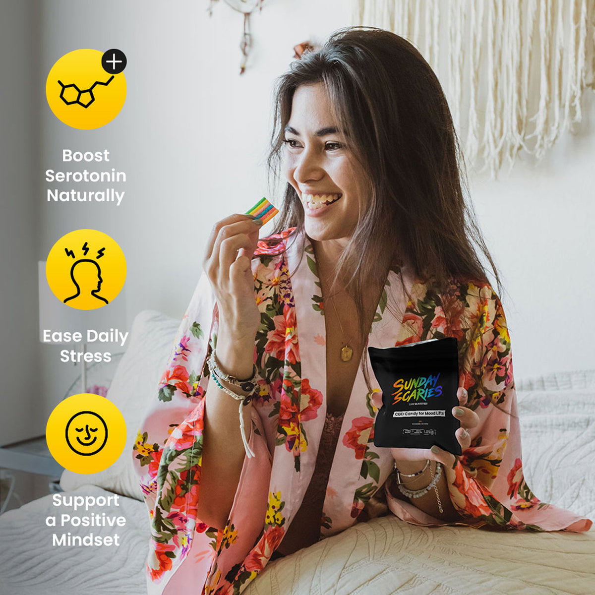 Woman in a floral robe holding a pouch of Sunday Scaries CBD candy with text about boosting serotonin, easing stress, and supporting a positive mindset.