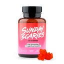 A bottle of Sunday Scaries CBD Gummies for Focus with a couple of pink gummy candies in the foreground.