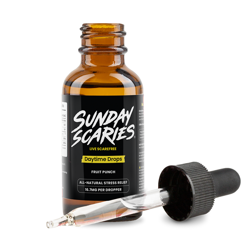 CBD oil dropper bottle labeled 'Sunday Scaries' with a pipette on a white background