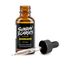 CBD oil dropper bottle labeled 'Sunday Scaries' with a pipette on a white background