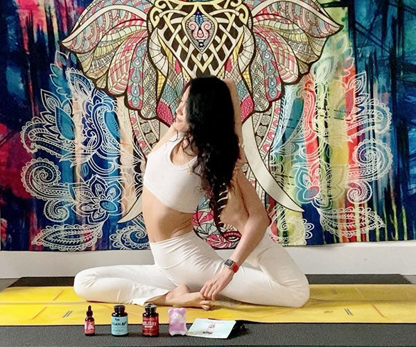 Image of influencer doing yoga and relaxing with Big Spoon Sleep Oil