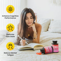 A woman journals on her bed next to two bottles of CBD gummies for focus and icons for how they'll make you feel