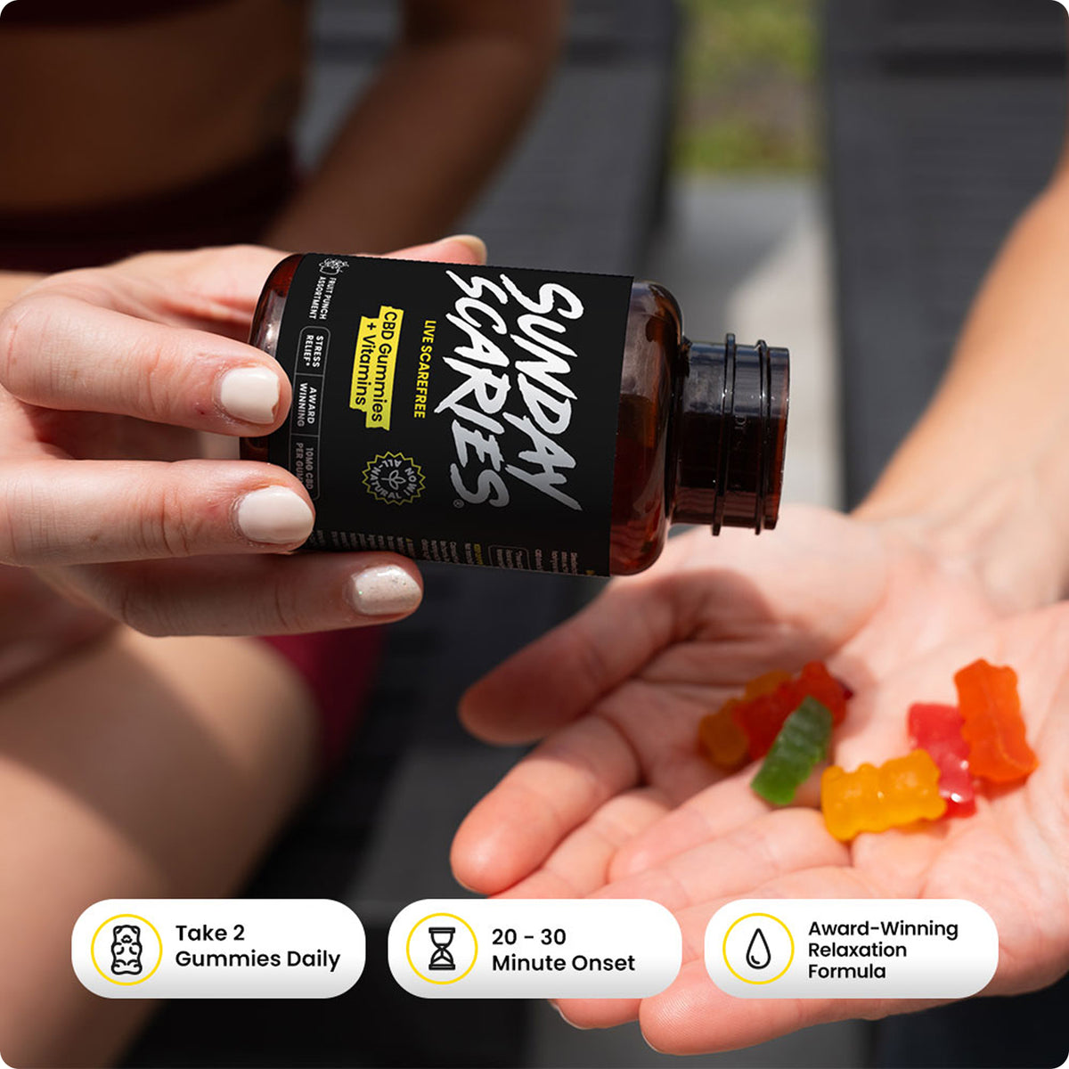 Person holding a bottle labeled 'Sunday Scaries' with gummy bears in their palm and product calls outs.