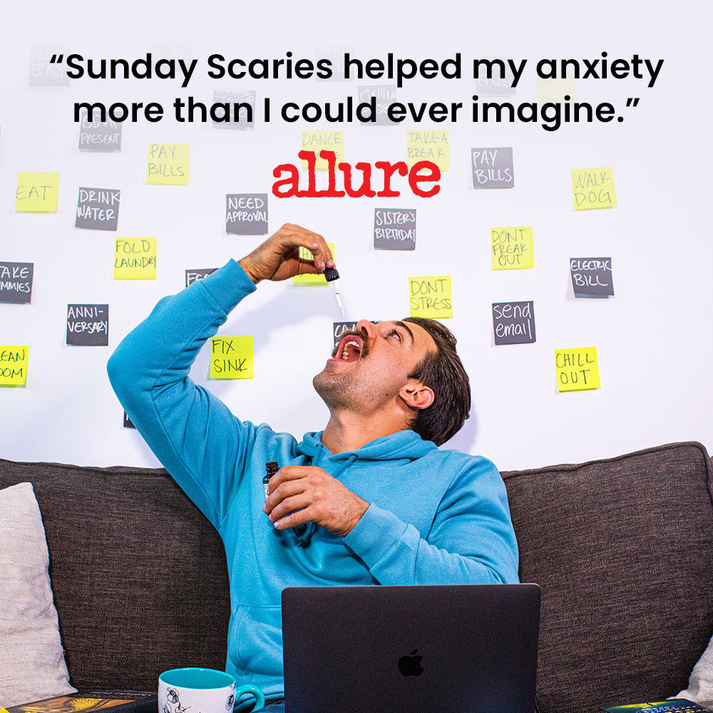 Man in blue sweatshirt sitting on a couch with a laptop, surrounded by sticky notes, with text about 'Sunday Scaries' and a quote from Allure: "Sunday Scaries helped my anxiety more than I could ever imagine."