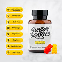 An amber supplement bottle labeled 'SUNDAY SCARIES' with a black cap, shown on a light gray background with a vertical row of yellow badges listing made with natural ingredients, gluten-free, GMO-free, vegan, soy-free, pesticide-free, and dairy-free. Two gummy bears, one red and one yellow, are placed in front of the bottle.