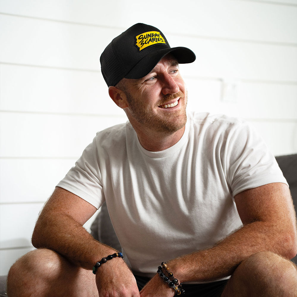 Sunday Scaries co-founder, Mike Sill, wears their snapback hat