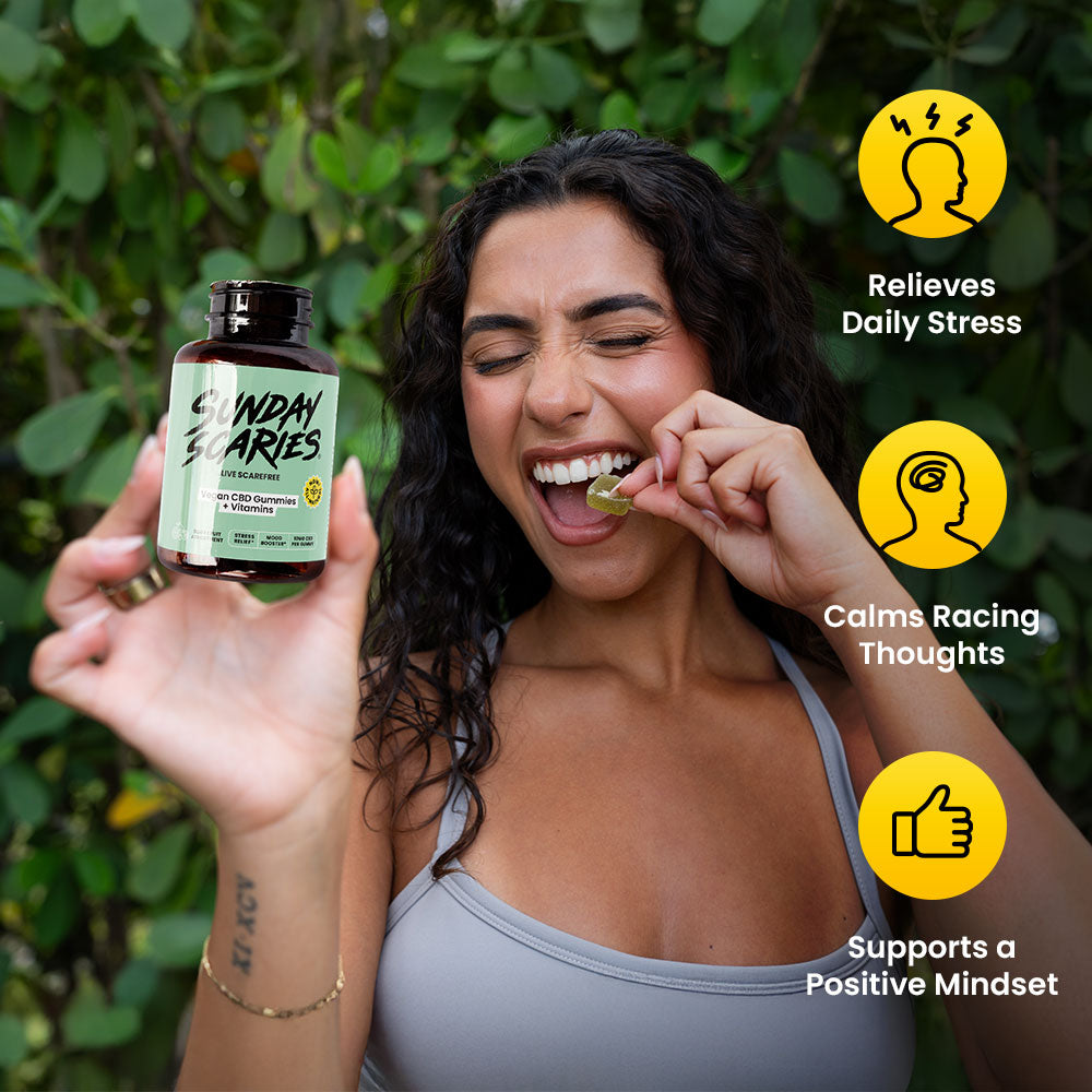 Woman holding a bottle of 'Sunday Scaries' vegan gummies with text about their benefits against a green leafy background.