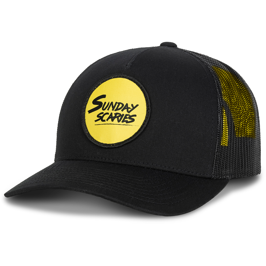 The Sunday Scaries Snapback has the yellow circle logo patch on the front with a 5 panel brim. 